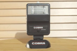 Boxed Cobra Auto 150S Universal Flash Unit. Features Include, Slave Unit, Stand And Original Instructions