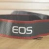 Black And Red Canon EOS Digital Strap. A Lovely Addition To Your Canon Set Up.
